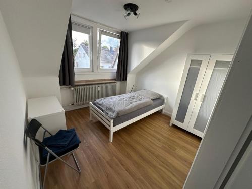 Postel nebo postele na pokoji v ubytování Fairpartement Düsseldorf