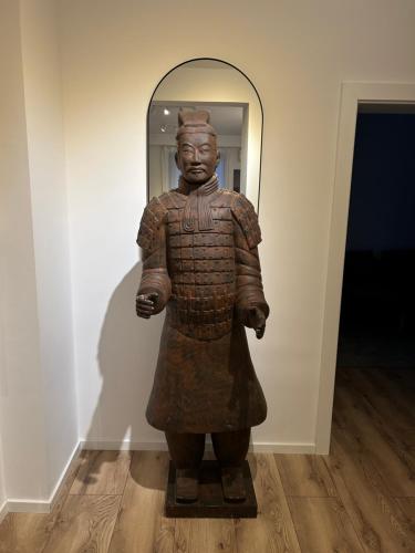a statue of a man on display in a museum at Apartament Anca in Sibiu