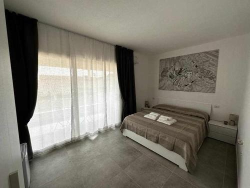 A bed or beds in a room at La Residenza del Re