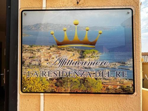 a sign on a building with a crown on it at La Residenza del Re! in Palau