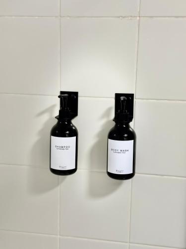 a couple of bottles of medicine on a tiled wall at Charmante Wohnung am Hafen in Bregenz