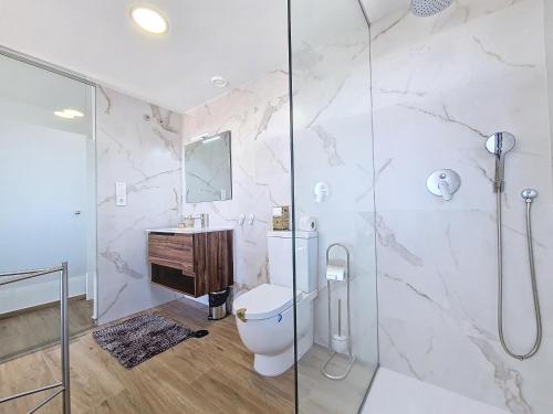 a bathroom with a shower and a toilet and a sink at Los Alcazares Velapi - 0510 in San Javier