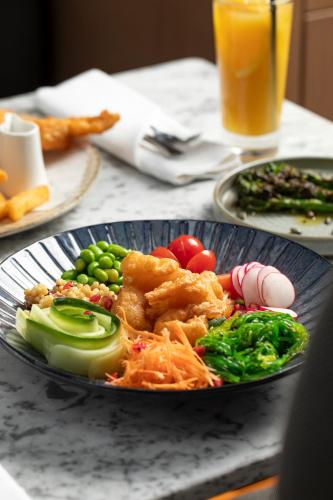 a plate of food on a table with a plate of food at Radisson Blu Hotel, Glasgow in Glasgow
