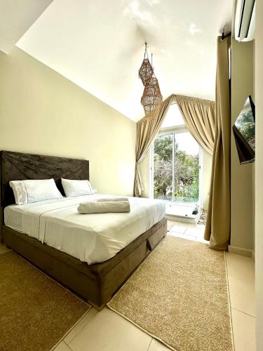 a bedroom with a bed and a large window at L'Amina - Peaceful 1BR Retreat with Cold Jacuzzi in Tangier
