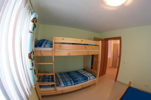 a bedroom with two bunk beds in a room at Ferienwohnung Radmer in Radmer an der Hasel