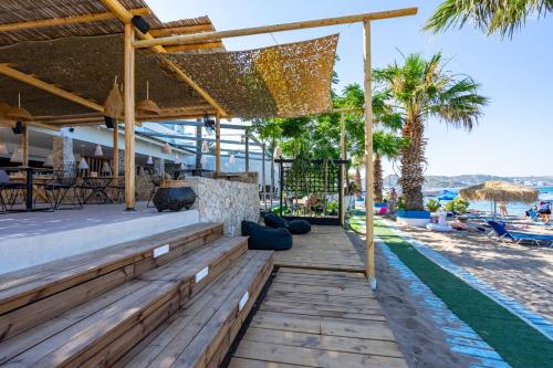 a resort with a swimming pool and palm trees at Lido Star in Faliraki
