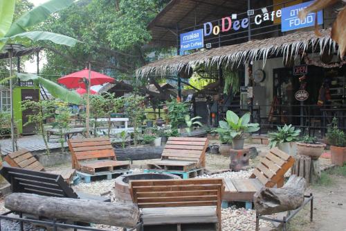 a group of chairs and tables in front of a store at Do Dee cafe in Bangkok