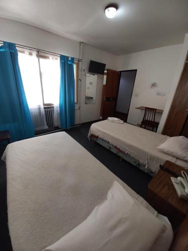 Postel nebo postele na pokoji v ubytování Residencial Ski