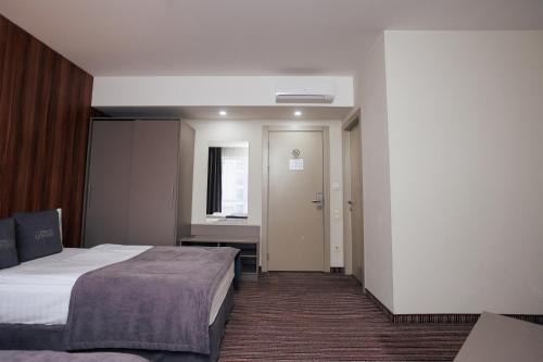 Katil atau katil-katil dalam bilik di Boutique Hotel Central