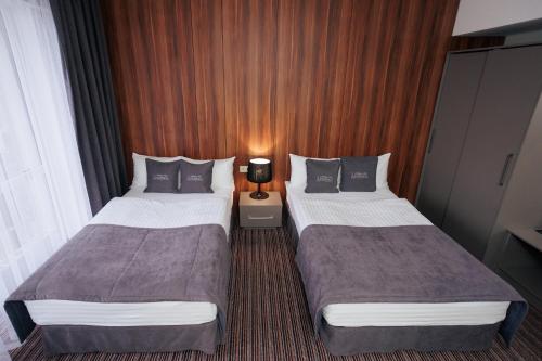 Katil atau katil-katil dalam bilik di Boutique Hotel Central