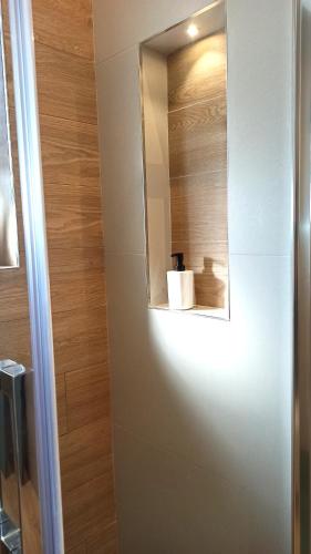 a bathroom with a mirror on the wall at Kemilia Matera in Matera