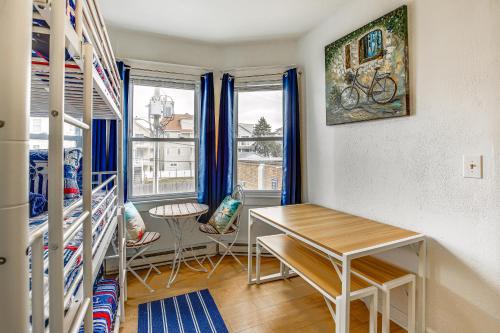 a room with a table and chairs and a window at Family-Friendly Ocean City Condo Walk to Beach! in Ocean City