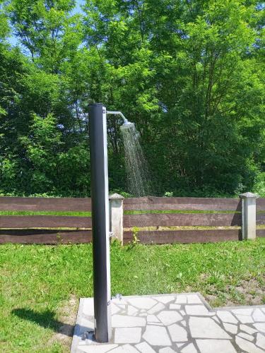 a water fountain in the middle of a park at Kuća za odmor Mažuran in Karlovac
