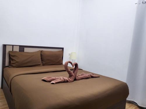 Postel nebo postele na pokoji v ubytování DOO KHAO