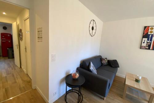a living room with a couch and a table at 06BD - Nice 6-person apartment facing the slopes in Péone