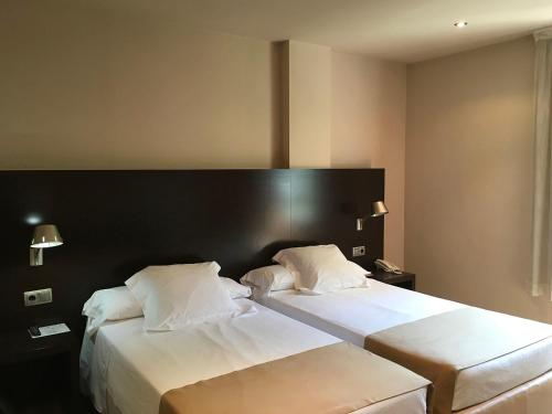 Кровать или кровати в номере Ramón Park-Hotel