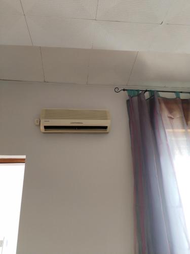 a air conditioner on the wall of a room at Buen Retiro - Bellona in Bellona