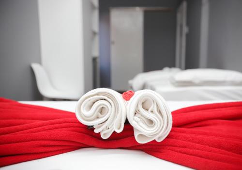 a pile of white lollipops on a red towel at Kingsworth inn Port Elizabeth in Port Elizabeth