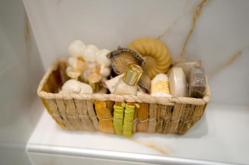 a basket filled with different types of items at Archontiko Alexandros Luxury Suites in Kardiá