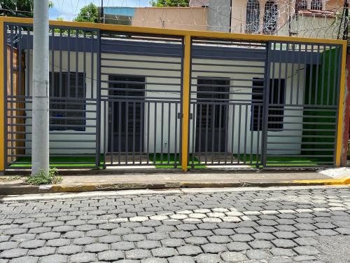 a building with a gate on the side of a street at Casa Mia in San Miguel