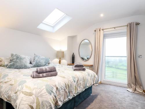 Ένα ή περισσότερα κρεβάτια σε δωμάτιο στο La Petit Maison