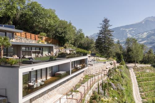a house on the side of a mountain at Private Suites COLLIS - Feel good Resort Johannis in Tirolo