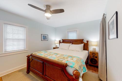 a bedroom with a bed and a ceiling fan at A Love of Leisure in Panama City