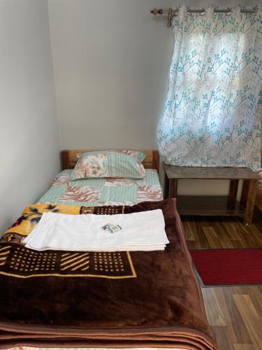 Postel nebo postele na pokoji v ubytování Pakha Dhim Homestay Namchi