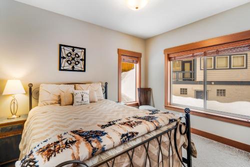 a bedroom with a bed and a window at Cascadia Clouds Chalet in Snoqualmie Pass