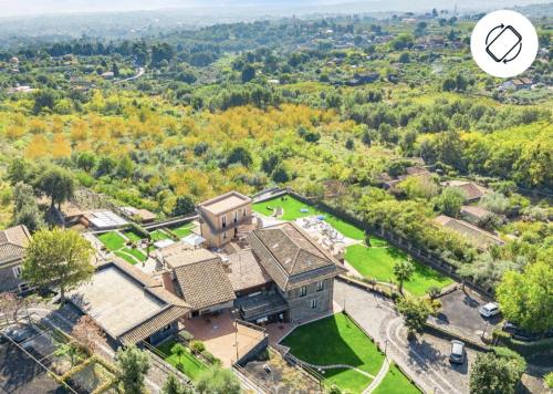an aerial view of a large house with trees at Antico Borgo Petralia in Zafferana Etnea