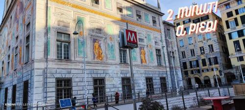 a building with a mural on the side of it at La Brignoletta Le Case del Dria Acquario suite in Genova