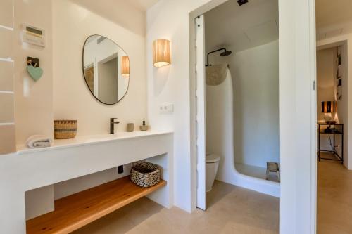 a bathroom with a sink and a mirror at Naraya - Managed By Almarina Villas in Jávea