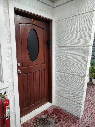 a wooden door with a letter b on it at Kandi Suites 2BR with private Jacuzzi 500 Mbps internet in Angeles