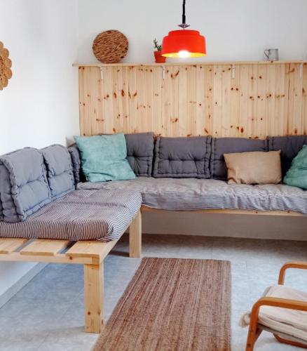 a living room with a couch and a table at AzuldoMar - Beach House in Odeceixe