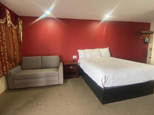 Postel nebo postele na pokoji v ubytování Masterson's Motel