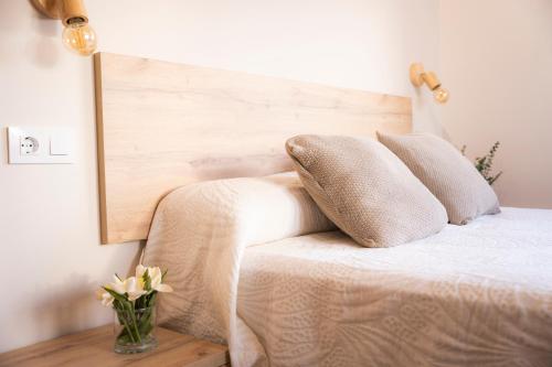 Cama o camas de una habitación en Apartamentos Alto Ubiro