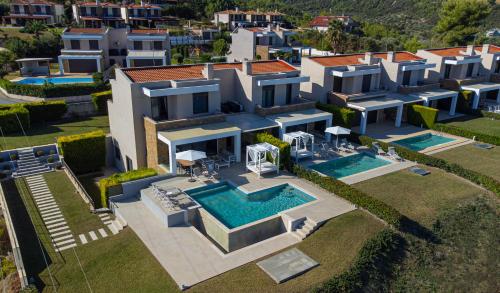 an aerial view of a house with a swimming pool at Bellevue Villas with private pool in Hanioti