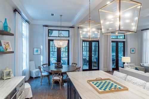 a living room with a table with a checker board at Sunday Morning in Santa Rosa Beach