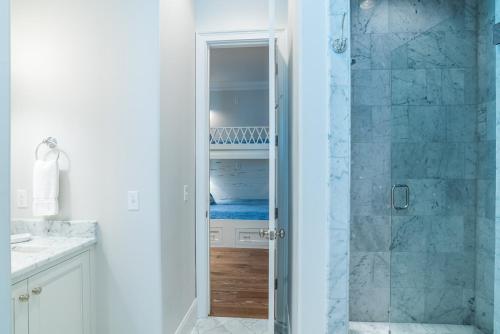 a bathroom with a shower with a glass door at Sunday Morning in Santa Rosa Beach