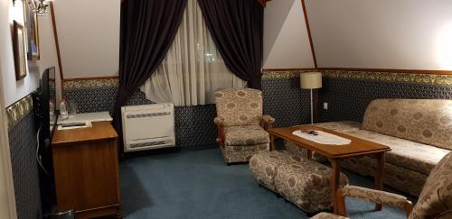 Χώρος καθιστικού στο Hotel Odeon