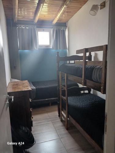 a room with two bunk beds and a window at Alojamiento el Ancla in San Rafael
