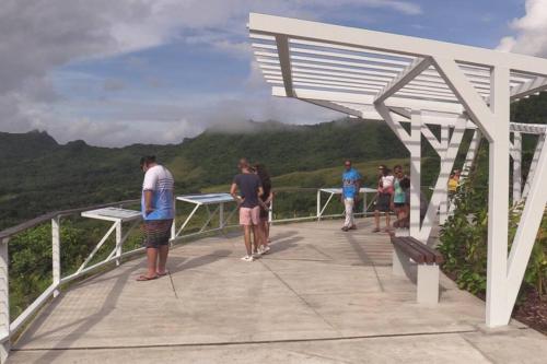 a group of people standing on the top of a mountain at Studio bord de mer Fare Tahitea Pension in Taputapuapea