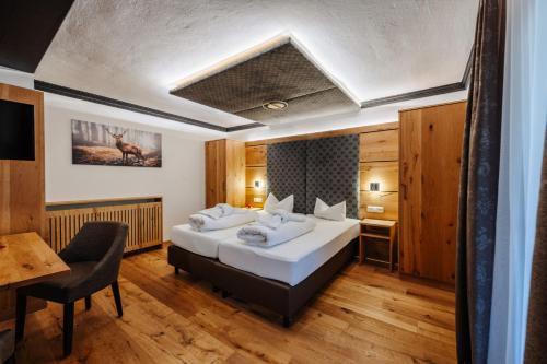 Uma cama ou camas num quarto em Hotel Rupertihof