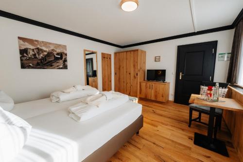 Uma cama ou camas num quarto em Hotel Rupertihof