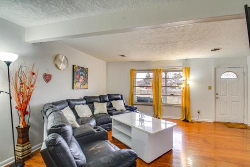 a living room with a couch and a table at Charming Lawton Escape with Patio and Grills! in Lawton