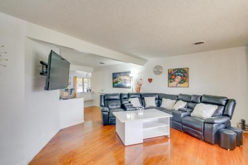 a living room with a couch and a table at Charming Lawton Escape with Patio and Grills! in Lawton