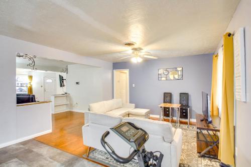 a living room with a couch and a tv at Charming Lawton Escape with Patio and Grills! in Lawton