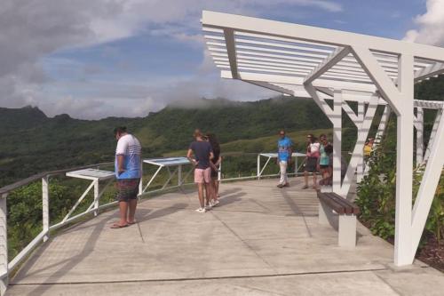 a group of people standing on the top of a mountain at Duplex en bord de mer Fare Tahitea Pension in Taputapuapea