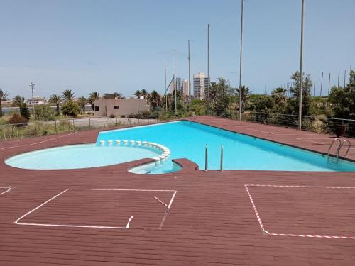 a large empty swimming pool in a building at VENEZIOLA TRAVEL, relax & beach in La Manga del Mar Menor