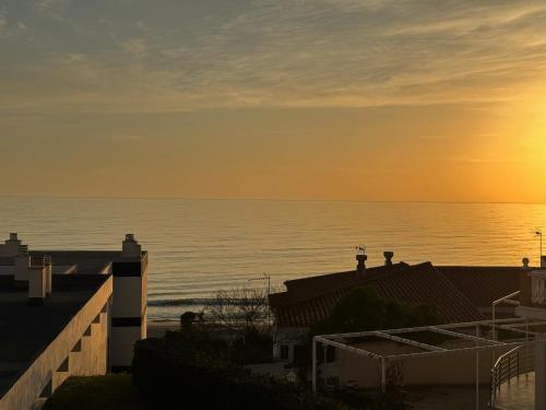 a view of the ocean from the balcony of a house at LUZ Y MAR in Matalascañas